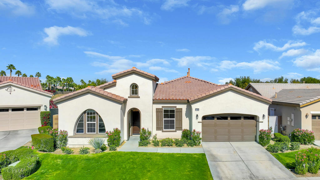Outstanding value for this pristine Talea plan in Trilogy at La Quinta. This home is super clean and feels like a new home, as there have been lots of updates over the past few years. Open floor plan, tile floors throughout, recessed lights in every room, 10 foot ceilings with crown molding, gourmet kitchen with two kitchen islands and two sinks, double oven and a new refrigerator, dishwasher and microwave. Complete whole house water filtration system as well as a reverse osmosis system in the kitchen. Covered patios off the kitchen (new pergola in 2023) and great room. Expansive primary bedroom with huge closets and custom pull down hanging racks. Primary bath with dual vanities and separate shower and bathtub. One of the guest bedrooms has an attached bath, and the other is set up as an office/bedroom. Dimmer switches on almost every light in the house. Epoxy flooring in the oversized garage. Newer washer and dryer with raised pedestals. Newer AC units (2022) with an air scrubber system. Newer interior and exterior paint (2022). Private backyard is surrounded by a green ficus hedge, and there is room for a pool and additional landscaping. Beautiful views of distant mountains from the front and backyard. Home is being offered furnished and the golf cart is included.