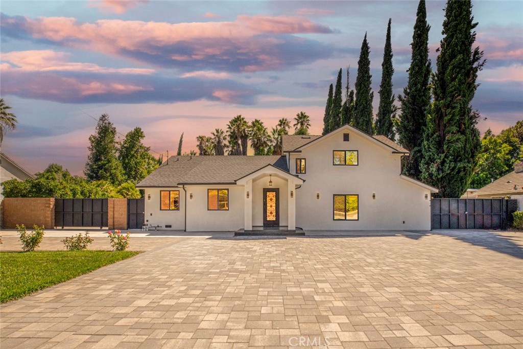 Welcome to this beautifully remodeled two-story modern residence located in one of Northridge’s most coveted neighborhoods—Sherwood Forest. Nestled on a generous 17,664 sq ft flat lot, this turnkey property offers the perfect blend of elegance, space, and functionality.
Step inside through a grand iron door and be greeted by an expansive open-concept living area that seamlessly connects to the formal dining and family rooms. The heart of the home is a fully updated modern kitchen featuring sleek dark glossy cabinetry, a striking tile backsplash, quartz countertops, and a large island topped with white stone—perfect for entertaining or casual dining.
This spacious home boasts 5 bedrooms, 6 bathrooms, plus a bonus room, offering ample flexibility for a home office, gym, or guest suite. All bathrooms have been thoughtfully renovated with stylish tile flooring, contemporary fixtures, soaking tubs, and walk-in showers.
Outdoors, enjoy your own private retreat with lush landscaping, trees, and a recently updated sparkling pool—ideal for relaxing or entertaining. The expansive driveway accommodates RVs, motorcycles, and more, complemented by new pavers, 2 car garage with abundant storage, and a charming covered outdoor area is perfect for lounging with friends and family.
Additional highlights include:
Double-pane windows throughout
French doors opening to the backyard oasis
Gated entrance with custom details
Whether you’re looking to host unforgettable gatherings or simply enjoy tranquil evenings under the stars, this home is charming. Don’t miss the chance to experience this exceptional property—schedule a private tour today!