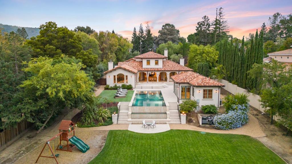 This stunning modern Tuscan estate was built in 2008 and meticulously updated in 2013. The 4,850 sqft main house is complemented by a 700 sqft full service guest/pool house. Located on the highly sought-after Karl Avenue, one of Monte Sereno's most prestigious addresses. Nestled on over 1-acre of beautifully manicured grounds, with 5-bedroom and 6-bathrooms, this masterpiece feels like your own private oasis. Elevate your outdoor gatherings and family fun in the resort style backyard, boasting an outdoor kitchen, picturesque poolside view, a sports court, bocce ball area, and a play structure on an oversized grass area. Additional highlights include a secure gated and fully fenced property, heated floors, climate-controlled wine room, smart home amenities, security system, whole house generator, TVs and a one of a kind marble dining table. This home seamlessly combines luxury and convenience.