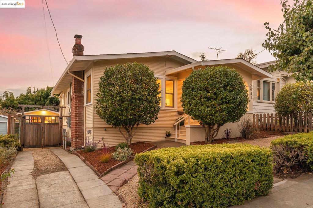 Rare find! Tucked at the end of a peaceful, tree-lined street, this beautifully crafted Upper Dimond Craftsman bungalow PLUS detached + fully permitted ADU blends timeless charm with thoughtful updates. Bright + vibrant, the main house features 2 beds AND a bonus passthrough room that doubles as a nursery, office, or 3rd bedroom; wood floors, built-ins, and period details celebrate the home’s history, while modern updates bring a fresh, elevated feel. The dining nook includes a custom table with bench storage seating and the updated kitchen includes new countertops, designer finishes, and modern appliances. PLUS dual pane windows, newer roof, outlet for car charging, dual-zone heat pump, A/C, rewired + retrofitted. Outside, enjoy colorful plantings, raised veggie beds, and a brick patio surrounded by trees and blooms—a space designed for slow mornings and backyard dinners. Two sheds, one wrapped in bougainvillea, provide bonus storage or creative space. The chic ADU—perfect for family, guests, or rental income, adds versatility with vaulted ceilings, stylish finishes, kitchenette, and full bath. Near 580 freeway, Laurel & Dimond District shops, local favorites like Farmer Joe’s + Sequoia Diner, and zoned for Sequoia Elementary.
