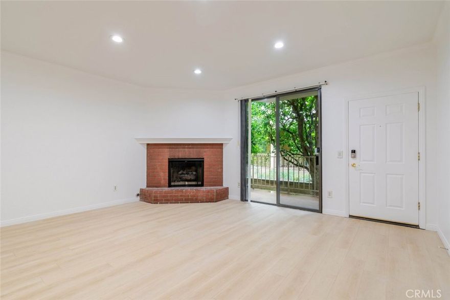 FLOORING WILL BE REPLACED WITH LAMINATE IN ALL BEDROOMS! NEW PAINT, NEW FLOOR. 4bed/3.5bath, large open floor plan! One room on garage level perfect for office, gym, or storage! The spacious living room has updated flooring, recessed lighting, connected balcony surrounded by trees and green. There is a cozy dining area, a wet bar and a bright kitchen with built-in appliances, refinished countertops and plenty of cabinet space. Additional private balcony space off one of the bedrooms. The primary bedroom has two sliding door closets, lovely bay window, a brick fireplace, along with a private bathroom equipped with a double sink vanity, a standup shower, and a soaking tub. Enjoy the last of your summer days relaxing by the building's community pool or spend your fall/winter days unwinding in the community spa. Community has ample shade and large trees, landscaped to perfection. Centrally located nearby to local library, cafes, restaurants, shops, local businesses, parks, Trader Joe's, Starbucks, Rite Aid, Chatsworth Charter High School, Lawrence Middle School, and minutes away from the Northridge Fashion Center and Westfield Topanga Mall & the Village, plus easy access to the 118 Freeway.