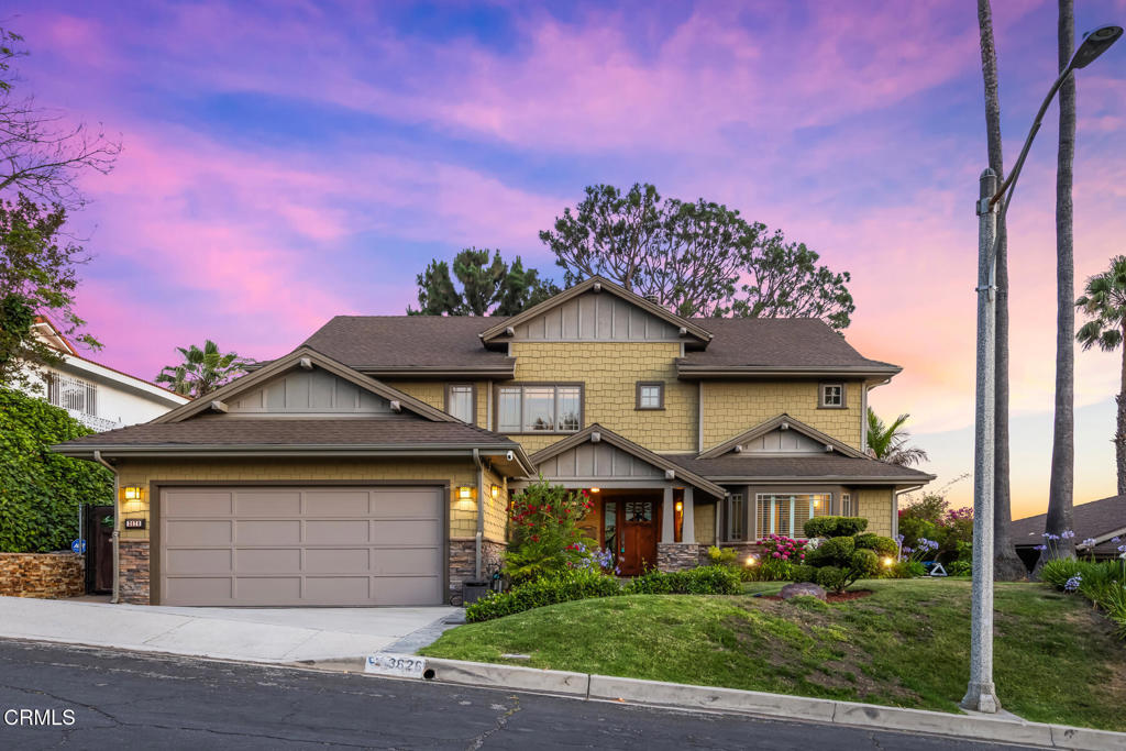 Perched to capture sweeping, panoramic views from nearly every room, this magnificent custom Craftsman, built in 2004, offers a rare combination of architectural charm, high-quality craftsmanship, and comfort. Designed for effortless indoor-outdoor living, the open-concept layout includes a living room with exposed beam ceilings and fireplace, a formal dining room, and a beautifully remodeled kitchen including a center island, stainless steel appliances, wine fridge, and bar area, all with access to the backyard. Three en-suite bedrooms, including a downstairs guest suite with a full bath and walk-in closet, are all spacious and filled with natural light. Upstairs, you'll find two additional suites, including a serene primary bedroom with dual walk-in closets, a private balcony with views, double-sided fireplace and an expansive spa-like bath with soaking tub, oversized, steam shower, and double sinks. A built-in hallway desk with lateral file drawers and shelving provides an ideal home office with mountain views, while a dedicated laundry room adds convenience to the upper level. Step outside to an entertainer's dream: a private oasis with a heated pool, above-ground spa, waterfall feature, and multiple lounging and dining areas, all set against a skyline of city lights, stunning sunsets and panoramic beauty. Additional features include a two-car garage with ample storage, a 220V EV charger, and a prime location near La Canada Flintridge, Montrose, Pasadena, and central Glendale, offering easy access to JPL, the Rose Bowl, Chevy Chase Country Club, and more.