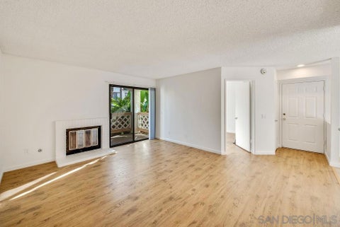 Photo of 9489 Fairgrove Ln Ln #103, San Diego, CA 92129 (MLS # 260023201SD)