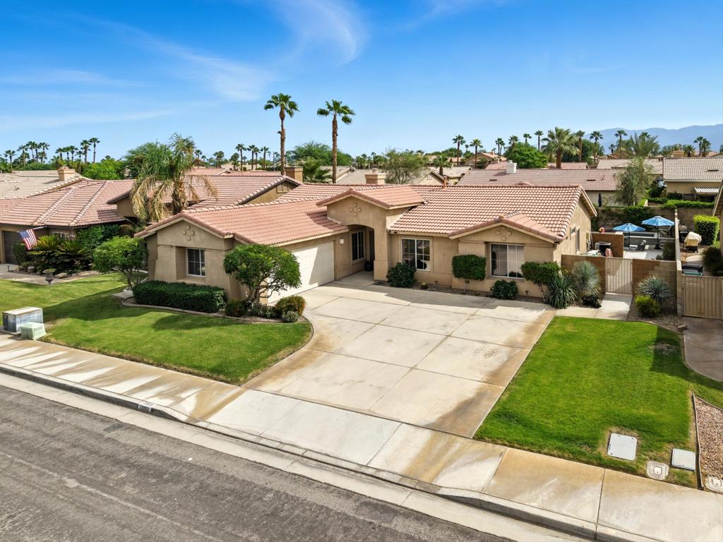Fabulous home in one of the most desirable North La Quinta communities... Monticello!! This 3-bedroom, 2-bath single-level residence has been lovingly cared for and offers a backyard built for FUN and relaxation with a nearly NEW saltwater pool and spa, low-maintenance turf grass, and plenty of space to entertain or unwind!! Inside you'll find an open and comfortable great room with a cozy fireplace and an easy flow into the kitchen and bonus room. The kitchen features granite countertops, a stylish tile backsplash, stainless steel appliances, and ample cabinetry. Right off the main living area, a flexible bonus room invites you to create your perfect space... an inspiring home office, a personal gym, a formal dining room, a playful lounge...the choice is yours!!All bedrooms are generously sized, with the primary suite featuring its own spacious bath, dual closet space and access to the rear yard! Every inch of this home shows pride of ownership.. spotless and move-in ready!Upgrades include newer A/C, newer hot water heater, Nest thermostat, and saltwater pool system. Washer, dryer, refrigerator, patio furniture, and pool furniture are all included in the sale -- move right in and start enjoying your desert lifestyle.Located within walking distance to highly rated North La Quinta schools and close to shopping, restaurants, freeway access, and more, this home blends everyday comfort with a true backyard oasis in one of La Quinta's most sought-after neighborhoods!