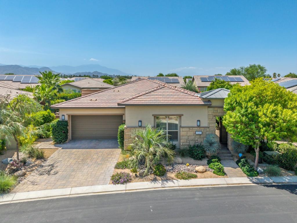 RARE OPPORTUNITY...Highly Customized & Meticulously Maintained Showstopper in CLOSE PROXIMITY to the CLUBHOUSE...Pristine SOLAR Powered Incantare Model (3BR/2.5BA + SmartSpace - 2,278 Sq. Ft. ) Featuring Attached 2-Room Casita & Exceptional Outdoor Living Area. Once you step into the formal entry you're met with the stunning sense of QUALITY, CHARACTER, AND CHARM. The open great room layout with high ceilings, built-in speakers, sparkling light fixtures, rolling walls of glass and formal dining room is the ideal centerpiece for hosting and entertaining. Spacious kitchen features upgraded lighting, dramatic island with bar seating, stainless steel appliances and upgraded cabinetry. The primary suite features separate vanities, upgraded stone and tile appointments, customized built-in closet and passthrough access to laundry/SmartSpace. The guest bedroom and adjacent powder bath are located off the entry, while the 2-Room Casita with private entrance features cozy sitting room / den with wet-bar and en-suite bedroom with customized walk-in closet. Thoughtful SmartSpace with built-in cabinetry features two work stations with slab counters. Spacious covered patio with built-in speakers, paver decking, 3 retractable awnings, built-in BBQ with Allumawood Pergola and sparkling pool/spa offers ample outdoor entertaining. Customized and air conditioned garage features built-in cabinetry / work station, overhead storage, epoxy flooring, and whole house water purification system. Sonos sound system included. Don't miss your opportunity to own one of Trilogy Polo's Finest! Membership transfer available.