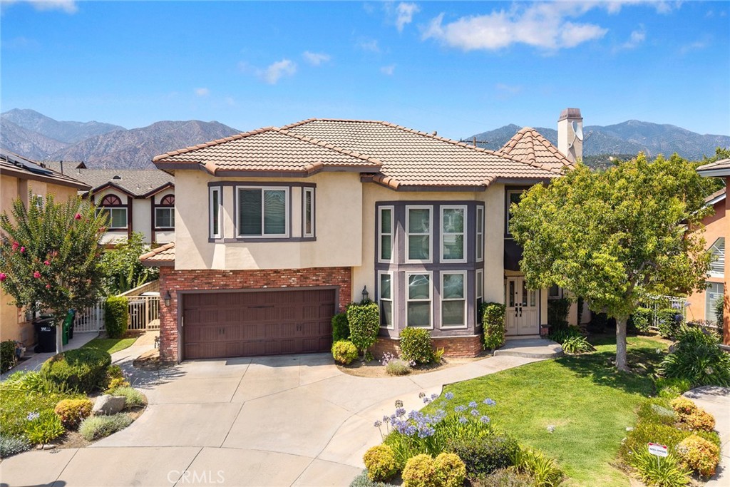 Welcome to this beautifully remodeled, turn-key home located on a quiet cul-de-sac in the highly sought-after Highland Oaks neighborhood of Arcadia. This elegant two-story residence offers 4 bedrooms and 3 bathrooms with a spacious 2,720 sq.ft. of living space. Thoughtfully updated throughout, the home features a bright and open floor plan with large bay windows, fresh finishes, and exceptional curb appeal. The main floor includes a desirable downstairs bedroom with a full bathroom—perfect for guests or multi-generational living. Upstairs, you’ll find generously sized bedrooms and updated bathrooms designed for comfort and convenience. Enjoy stunning mountain views and a prime location just minutes from award-winning Highland Oaks Elementary and Foothills Middle School in the top-rated Arcadia Unified School District. Close to parks, shopping, dining, and Ralphs Fresh Fare, this move-in ready home blends modern living with an unbeatable location.
