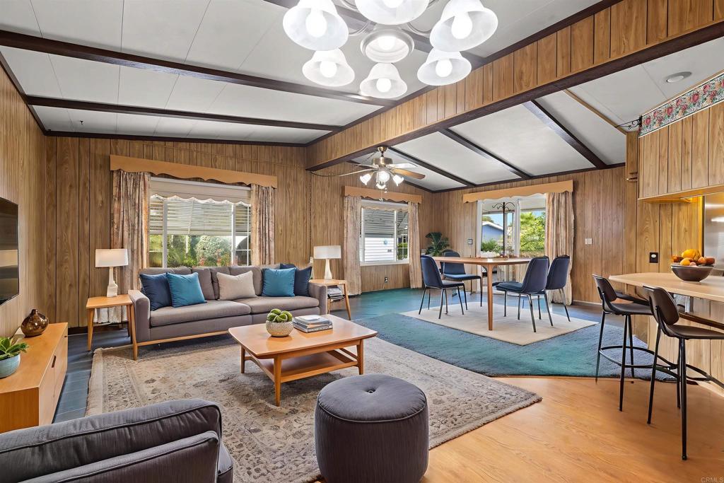 Located in gorgeous senior (55+) park with 8 sparkling lakes, acres of green belts filled with trees and flowers! NO PROPERTY TAXES AND RENT CONTROL add value and stability. This home has been improved and has copper plumbing, solar panels, new water heater, drip irrigation system, extra large storage shed, walk in shower, two refrigerators with ice makers, washer and dryer and much more (see complete list at home). Park has pickle ball/tennis court, covered shuffle board court, year round heated pool and in room spa, huge club house and banquet room, card rooms, library and more! Commuter, Amtrac and Sandy Beaches about 4 miles away! Lots of Grocery stores, restaurants, bus stop, medical services close by! Extra wide drive way for easy in and out Where you live has a lot to do with how you feel and you'll feel good as soon as you enter the front gate!! COME TAKE A LOOK!