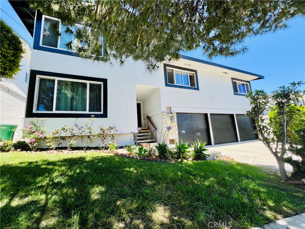 Spacious, Ocean View 4 bedroom/2 bathroom (plus Huge Bonus Room) family home in the heart of the desirable Los Verdes neighborhood in RPV. Entry level opens to a large living room with gas fireplace and access to a ground level bonus room with great indoor/outdoor flow carrying to a lushly landscaped backyard. Main level features a bright, large kitchen, huge balcony perfect for entertaining.. as well as two bedrooms and one full bathroom. Upper level has two more bedrooms and a full bathroom. Bonus room is a huge finished basement, with endless options of a family room, game room, workout room, home office and more. Other features include: Central Heating & AC, luxury vinyl floors, vaulted ceilings, large three-car garage, built-in bar, newer dual pane windows, massive backyard, tons of natural light & ocean views and more... Tucked away on a quiet, loop-around street in the highly sought after Palos Verdes Peninsula Unified School District.