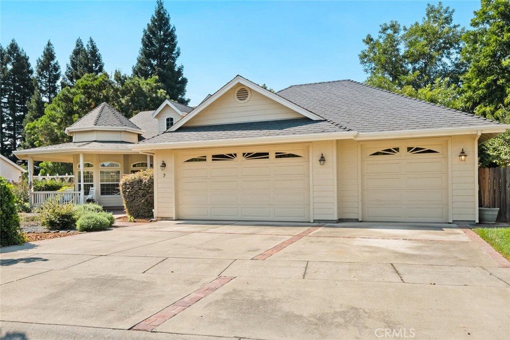 Just a block from Bidwell Park, this stunning custom-built home offers the perfect blend of elegance, comfort, and thoughtful design. Step inside and you’ll immediately notice the soaring 10’ ceilings, crown molding, extra-wide baseboards, and solid oak hardwood flooring that create a timeless, sophisticated atmosphere. The open floor plan is filled with natural light and enhanced by recessed lighting, custom blinds throughout, and a cozy Vermont Casting wood stove. The chef’s kitchen is a true showstopper with custom solid wood cabinetry, under-cabinet lighting, a large pantry, trash compactor, water filtration/softener system, and constant hot water recirculation. The luxurious primary suite boasts a heated bathroom floor, jet tub, and a spacious walk-in closet with custom built-ins. Every detail has been considered, from the attic exhaust fan to the finished garage and shop space with custom cabinetry and dual garage doors. Step outside and enjoy the wrap-around Trex porch, built-in plumbed gas BBQ with refrigerator, covered back deck with ceiling fan and stereo speakers, and beautifully designed drought-resistant landscaping with irrigation and drip systems. A pond with a waterfall, vegetable garden with shed, and mature trees create a peaceful retreat you’ll never want to leave. With central AC (new in the last 2 years), a water conditioning system, and an unbeatable location near Chico’s beloved Bidwell Park, this home truly has it all. Don’t wait, homes like this don’t come around often!
