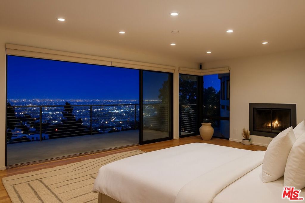 Striking contemporary Hollywood Hills view home now available for lease, offered fully furnished, available up to 6 months. Expansive sliding glass doors flood the space with natural light and frame stunning floor-to-ceiling views of the city and lush greenbelt. This 2-bedroom, 2.5-bath retreat offers a seamless blend of indoor-outdoor living with nearly 1,000 square feet of massive deck space, perfect for entertaining or relaxing above the city. An open floor plan, maple flooring, and clean, modern finishes create a sleek yet comfortable ambiance throughout. The oversized primary bedroom is a luxurious haven, featuring a jumbo walk-in closet and a spa-like bath and shower. Privately located on a quiet street just moments from some of LA's best restaurants, nightlife, and live music, this is Hollywood Hills living at its finest. Enjoy the summer in your dream Hollywood Hills home.
