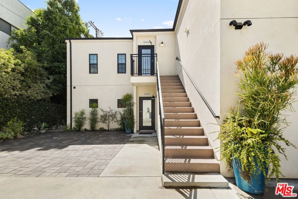 Turnkey Investment Gem in the Heart of Toluca Lake! Welcome to an exceptional income-generating opportunity in one of Los Angeles' most coveted neighborhoods. Perfectly positioned in prime Toluca Lake, this beautifully upgraded property offers rare versatility with high-yield potential ideal for investors, owner-users, or anyone looking to capitalize on strong rental demand.At the front, a charming 2-bedroom, 2-bathroom Spanish-style home has been tastefully remodeled, blending timeless architectural appeal with modern comforts. Enjoy private outdoor living spaces that include a cozy fire pit, serene Moorish-inspired water feature, and mature drought-tolerant landscaping all curated for low-maintenance luxury and guest enjoyment.Tucked behind the main residence lies a sleek, fully permitted duplex built in 2018designed with both form and function in mind. Each of the two 2-bedroom, 2-bath units features contemporary interiors with stainless steel appliances, subway tile showers, in-unit laundry, and private outdoor patios. The upper unit offers two balconies ideal for relaxing or enjoying LA's signature sunshine. Not subject to Rent Stabilization (buyer to verify), the duplex offers added flexibility for short-term or long-term rental strategies.Each unit is separately metered for utilities, enhancing convenience and management efficiency. Vibrant murals, lush greenery, and tranquil water elements elevate the outdoor experience, making this property highly attractive for both tenants and guests.Centrally located near major studios including Warner Bros., Disney, and Universal, and just minutes from iconic destinations like the Hollywood Bowl, this property is perfectly positioned to attract entertainment professionals and tourists alike. With easy access to the 101, 134, and Metro stations, commuting across LA is effortless.Whether you're seeking a high-performing asset or a unique live/rent hybrid opportunity, this fully turn-key property delivers on all fronts. Don't miss the chance to own a premier income-producing retreat in the vibrant heart of Toluca Lake.