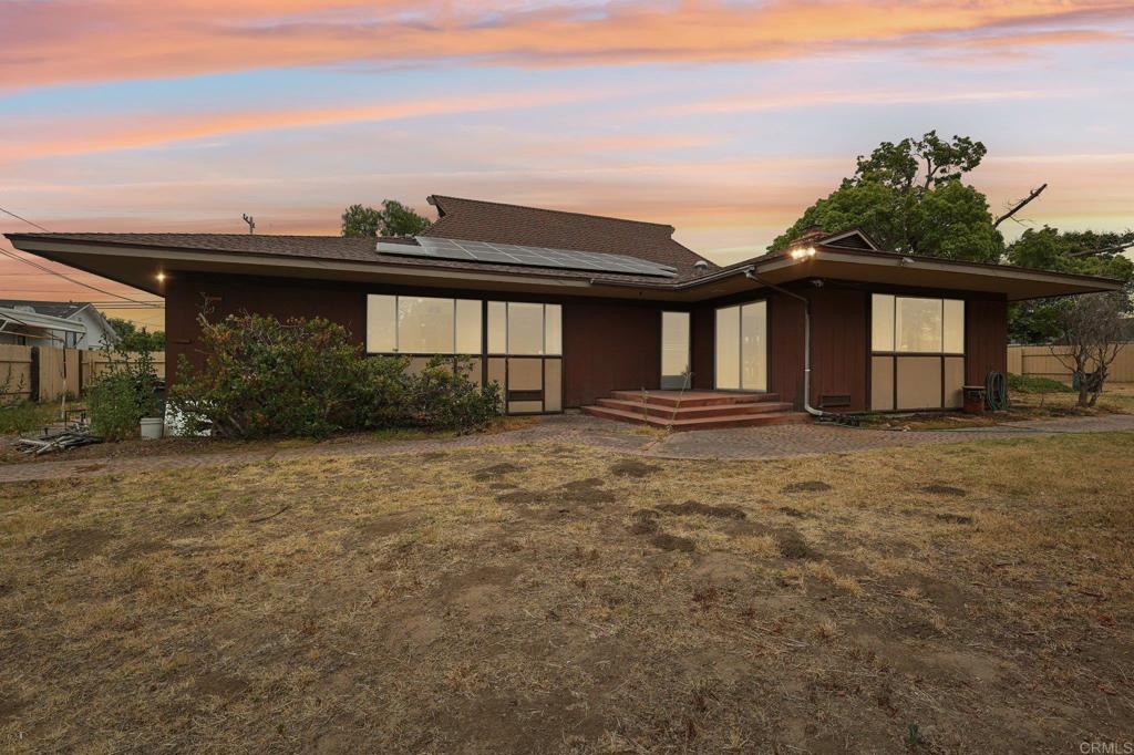 Charming vintage single-level 4 bedroom 2 bathroom home set on an oversized 0.68 acre lot with endless potential including possibility to add an ADU. This is a rare find for midcentury enthusiasts featuring original details like unique tile and wallpaper, built-ins, vintage cabinetry, and period-specific design elements throughout. The spacious kitchen includes a gas cooktop and built-in oven, with plenty of room to modernize or keep the retro charm. Giant family room has plenty of windows to let in great natural light, a cozy stone fireplace, and slider that leads to a covered porch overlooking the backyard. Bonus sunroom off the family room is versatile for an office space or extra lounging space. Also included is a mudroom complete with a built-in dog wash station. Tons of storage options throughout the whole home. Outside, mature shade trees surround a wide circular driveway offering easy access and curb appeal. Behind the double gates, there’s ample space for RV, boat, etc. Detached 2-car garage and large circular driveway provide tons of parking options. Located just minutes from historic downtown Chula Vista, local parks, the Bayfront redevelopment including the brand new Gaylord Resort, and top-rated schools, this property combines timeless design with a convenient lifestyle with NO MELLO-ROOS or HOA. Whether you want to preserve its vintage style or update it to your taste, this home offers flexibility, functionality, and great value.
