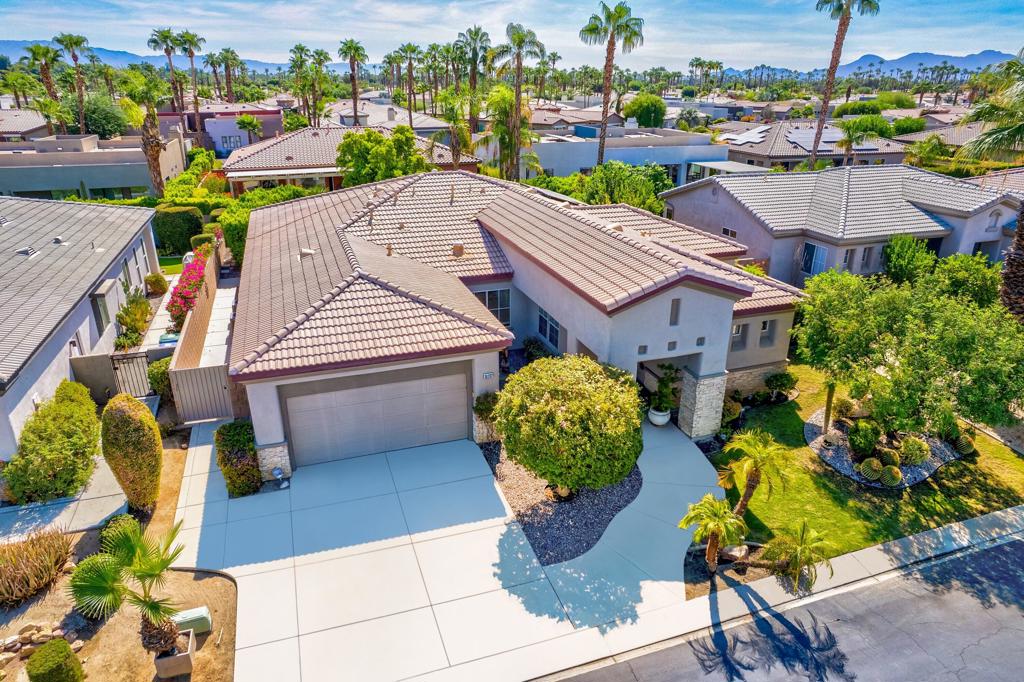 Terrific opportunity in the small gated community of Aldea located on the Cathedral City and Rancho Mirage border (@Gerald Ford & Da Vall Dr.) where You Own The Land. Freshly Painted Inside & New Carpet in Bedrooms. Home Features 10 Ft. ceilings throughout & Solar Tubes bring in extra light. 3 Bedrooms, 3 Baths & a flex room currently configured as a Den with built-ins. Formal Living Room & Family Room with built-ins. Open plan kitchen with island & lots of storage. Primary Suite has Walk-In Closet, Remodeled Shower & Dual Sinks in Bath. Individual Laundry Room w/cabinetry & sink. Direct Access to Double Car attached Garage with cooling. 8 Panel owned Solar system. Established landscaping with mist system, a Spool & Waterfall. Community has walking path and greenbelt area for socializing and/or dog walking. Perfect Mid-Valley location, close to Shopping & Golf. 15 minutes to PS Airport and 15 minutes to famous El Paseo Shopping area. Low HOA Dues. Don't miss out on this opportunity. Priced to sell, hurry this one won't last!