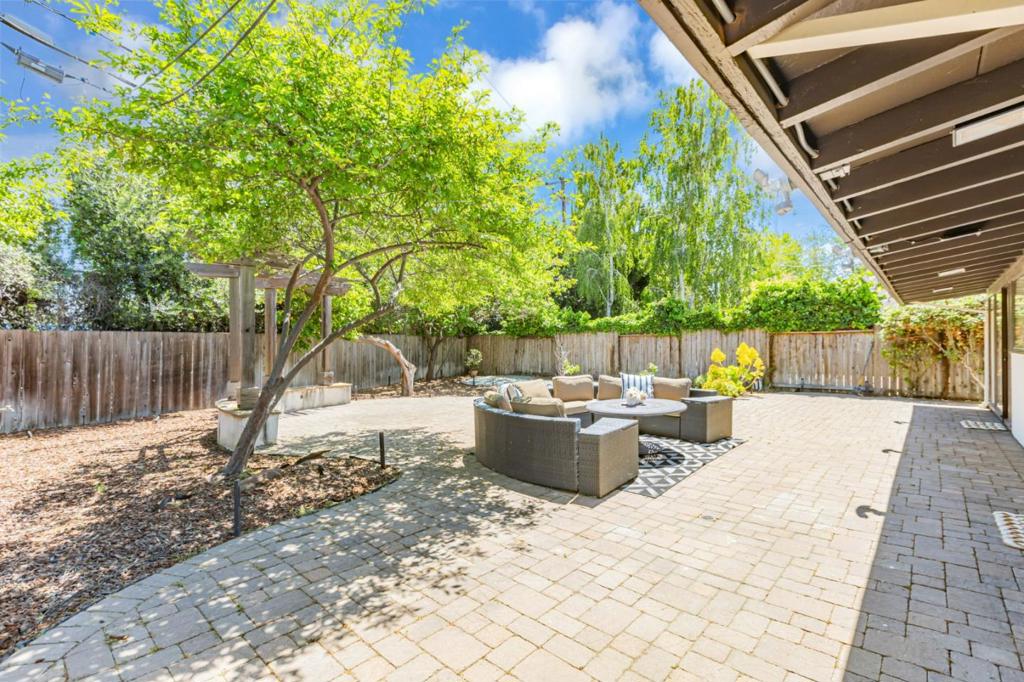 SIGNIFICANT PRICE REDUCTION! DONT MISS THIS OPPORTUNITY! Sunlit, modern home in prime Santa Clara! Enjoy top-rated Cupertino schools! Resort-style, large & deep backyard. The bright main unit offers 3 BR (+ an office) and 3 BA, and a permitted 490 sq ft ADU with its own address & entrance, seamlessly connected to the main house. Combine the units for expanded living space, or use the ADU separately with full autonomy. The spectacular backyard offers elegant paving, a pergola seating area, lush trees, and low-maintenance landscaping. The home offers open living spaces with natural light from skylights, great airflow, and scenic views. Cook in the gorgeous kitchens for both the main unit and the ADU, with stylish cabinets, stainless steel appliances, quartz countertops & island with seating. Retreat to the primary bedroom with high ceiling, a walk-in closet with custom shelving, beautifully designed bathroom. Oversized modern guest bathroom! Additional perks include an EV charger, upgraded electrical panel, tankless water heater, and mini-split AC in the primary suite and ADU. Unbeatable location: ~2 miles to Apple Park; 2-6 miles to NVIDIA, Google, Meta, Amazon. Walkable to elite private schools (Stratford, Morningstar), Maywood Park, near top dining(Lion City, Mitsuwa plazas)!