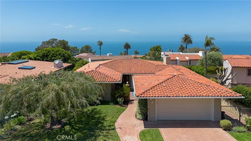 Discover the charm and lifestyle of Malaga Cove in this beautifully crafted coastal home, perfectly situated in the heart of Palos Verdes Estates. Thoughtfully designed to capture the essence of Southern California’s indoor-outdoor living, this residence boasts captivating views and expanded living spaces—ideal for entertaining, or quiet relaxation.



Begin your tour on the main level by entering an elegant private courtyard. This leads to the dining area that connects seamlessly to a beautifully updated kitchen featuring granite countertops, crisp white cabinetry, premium stainless-steel appliances, and a chef-caliber 6-burner stove. Just beyond, the light-filled living room serves as the heart of the home—warm and welcoming with hardwood floors, a cozy fireplace, and dramatic floor-to-ceiling pocket glass door that reveals a partial ocean view and opens onto a picturesque deck. The main level also features a tranquil primary suite with a private bath, alongside a second bedroom and a hallway bathroom with dual sinks. 



Downstairs, the lower level expands your options with a third bedroom, an additional bathroom, a laundry room, and a versatile 4th Bedroom with its own fireplace and patio—perfect for guests, a home office, media room, or personal gym.



Additional highlights include:



• 3-zone A/C system (2 condensers)

• Updated windows and doors

• EV charger in the attached two-car garage



Located just minutes from Malaga Cove Plaza, scenic trails, renowned schools, and pristine local beaches, this home embodies the best of Palos Verdes Estates living—elegant, effortless, and ready to enjoy. Truly a rare opportunity.
