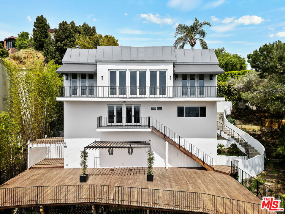 This beautiful Hollywood Regency home with gated entry is situated on a private cul-de-sac in the hills minutes from Sunset Blvd and features city and ocean views. After an extensive renovation this property is ready for a new tenant, Upon entry you will be taken back by the inspiring views that will immediately garner your attention due to the expansive windows and multiple French doors that frames this cityscape. Bright updated kitchen with new Frigidare appliances and walk in pantry, a charming breakfast nook is the perfect place to begin your day with views to your charming front courtyard. Downstairs is the primary suite with two walk in closets and a large built in wardrobe, ideal for anyone with a sizeable clothing and shoe collection. This homes biggest feature is the massive outdoor deck that is optimal for entertaining or relaxing due to its private and quiet location. New security system + cameras, and built in speakers throughout for Sonos. A 2-car garage completes this home that is a true Sunset Plaza gem.