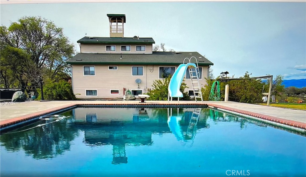 Multi resident compound ideal for the active family located in the peaceful landscape of Lakeport, CA, this exceptional PRIVATE 37.8-acre usable semi-flat estate offers an unparalleled opportunity including potential vineyard for refined country living. —ideal for active families, hobby ranchers, or investors. The semi-flat, fully usable land offers endless opportunities, including vineyard potential, and features a 4,640 sq ft main home with 5 bedrooms, 3 remodeled tile bathrooms, an oversized family room with stunning views, central heat and A/C, and a private primary suite with a jacuzzi tub and balcony. Below the main home is a separate 2-bedroom, 1-bath apartment, while a detached 980 sq ft 2-bedroom, 1-bath guest house with garage provides additional living space—both currently rented for immediate income. Designed for an outdoor lifestyle, the property boasts a 20’x36’ saltwater pool, firearms range, ATV track, seasonal pond, koi pond, and a winter creek. It’s fully fenced and cross-fenced for horses or cattle, complete with a large animal corral and 3,000 sq ft Quonset hut. Additional amenities include a main shop with 220 power, paint shed, sports equipment shed, greenhouse, chicken coop, and bird aviary. Sustainability is key, with owned solar panels and Tesla batteries already in place. Ranch equipment and seller financing available with negotiable terms—this is a MUST-SEE compound offering unparalleled privacy, functionality, and lifestyle potential.