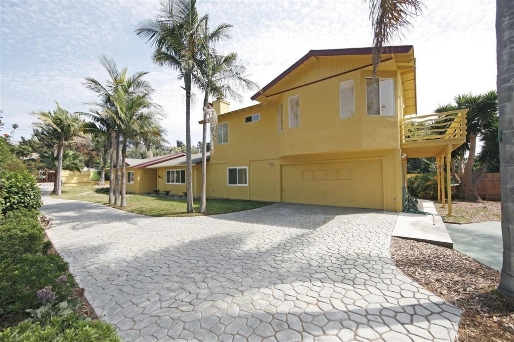 Quintessential Avocado Acres of Encinitas. Come enjoy the quiet tree lined street in the comfort of this gated home. Complete with large yard, separate living and media rooms, as well as an expansive master suite on a floor of its own with a spacious deck. Artistically finished with concrete counters, sun-drenched floor-plan, ample parking and a flourishing side garden. All of this in a highly functional home ideal for families or a couple who enjoys guests and entertaining. Neighborhoods: Avocado Acres