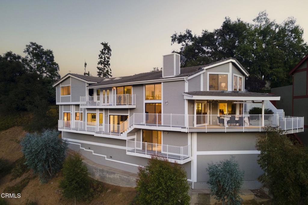 Welcome to 363 Patrician Way. Situated in the sought-after N San Rafael neighborhood with sweeping hilltop views from DTLA to the San Gabriel Mountains and neighboring Annandale Golf Club. An entertainer's home! The open museum quality layout showcases polished sophistication and an abundance of vistas from the numerous bird's-eye view windows. A floating living room flows down to an open and airy formal dining room, which overlooks an elegant bar and lounging area featuring a marble fireplace. The expansive gourmet kitchen with custom white marble flooring, granite countertops, and cabinetry is set apart in a private manner, ideal for catered dinner parties and entertaining. Three beautifully appointed bedrooms line the lower floor. One of them is a luxurious master suite featuring a jetted bathtub and a large walk-in closet, as well as a spacious walk-in closet and multiple vanity spaces. The setting is serene, peaceful, and private. The home has been meticulously cared for and maintained since its 1980 construction, and the newly installed fire-resistant Hardie board siding and trim on the exterior walls have just been completed, adding a fresh look and peace of mind.