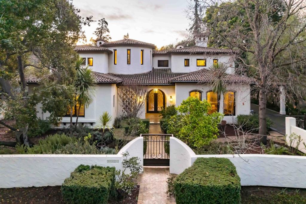 An unparalleled setting in one of Palo Alto's finest neighborhoods provides the backdrop for this spectacular estate on over half of an acre. Impeccable details, smart home features, and high-end materials grace nearly 6,000 sf of space and create an air of luxury and elegance. A spacious living room and dining room, gourmet kitchen, family room with an adjoining kitchenette, and an executive office provide refined spaces for both entertaining and daily life, while the primary suite featuring a spa-like bathroom elevates the home's 5 en suite bedrooms. Five-star grounds offer the ideal venue to enjoy a California indoor/outdoor lifestyle with a Viking outdoor kitchen, 50'-long heated pool, and a cabana, all framed by 2 majestic palm trees. Situated within walking distance of vibrant University Avenue, this estate is also mere moments to beautiful parks, Stanford University, convenient commute options and top-ranked public and private schools (buyer to verify eligibility).