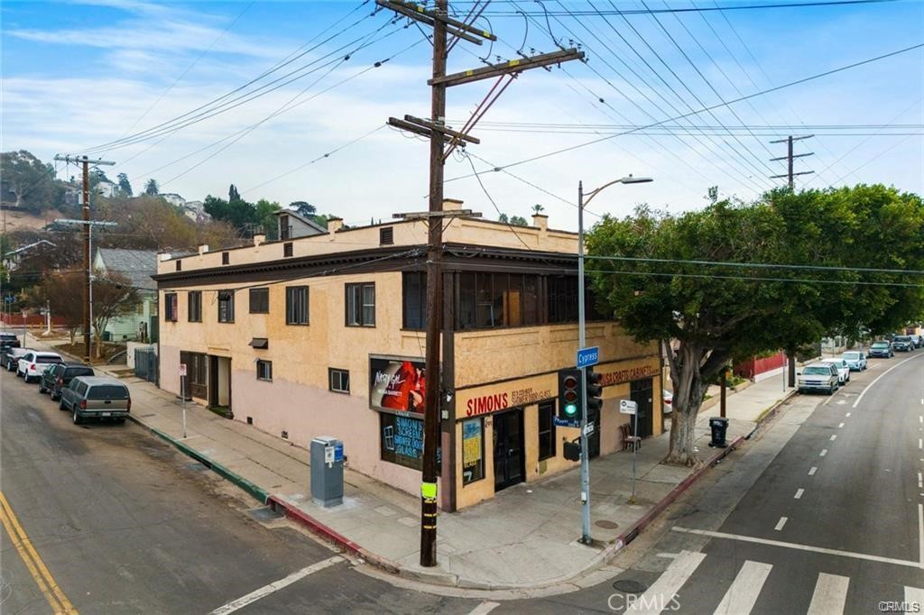 Discover an incredible investment opportunity in the heart of vibrant Cypress Park! This versatile property features two commercial units at street level, perfect for retail, office, or creative space, offering excellent visibility and foot traffic along Cypress Ave. Above the commercial spaces, you’ll find five residential apartments. The apartments boast a mix of layouts and size. Located in the highly sought-after Cypress Park neighborhood, this property benefits from a thriving local community and proximity to some of Los Angeles’ most exciting attractions. Just minutes away, enjoy the eclectic shops, trendy cafés, and popular eateries of Highland Park, Frogtown, and Glassell Park. Outdoor enthusiasts will love the nearby Los Angeles River Bike Path and access to sprawling parks like Elysian Park and Rio de Los Angeles State Park. With a unique blend of historic charm and a rapidly emerging cultural scene, Cypress Park is quickly becoming one of the city’s most desirable places to live, work, and play. With easy access to major freeways, public transportation, and a steady influx of creative professionals and young families, this multi-use property is ideally positioned to capitalize on the area’s continued growth. A rare find with significant income potential, this is a must-see for savvy investors looking to secure a cornerstone in one of Los Angeles’ most dynamic neighborhoods!