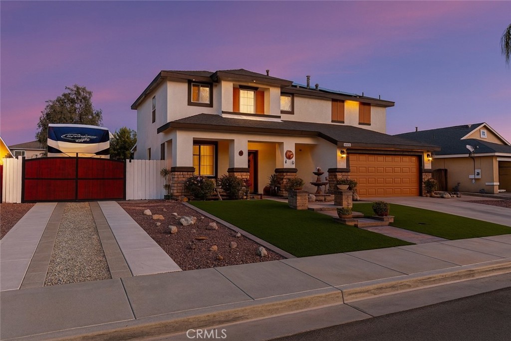 Welcome to a home designed for gatherings and good times! From the moment you enter, the living spaces flow easily to the backyard, creating a seamless indoor/outdoor experience ideal for weekend barbecues, game days, and celebrations. The rear yard features an outdoor bar area perfect for serving drinks and appetizers, plus a dedicated dog kennel to keep four-legged family members comfortable and secure.
Need space for your toys? Enjoy true RV parking with power and water hook-ups (no sewer)—bring the trailer, boat, or coach. The home also includes solar panels to help keep your energy bills low while you live comfortably year-round. Thoughtful touches, low-maintenance landscaping, and ample patio space make entertaining effortless.
The home itself features all of the bedrooms upstairs with an en-suite featuring a separate shower/tub. The upstairs landing has plenty of room for a space to relax and unwind.
Convenient Hemet location close to everyday essentials and area amenities. This one checks the boxes for lifestyle, efficiency, and fun—come see why this home was made for entertaining!