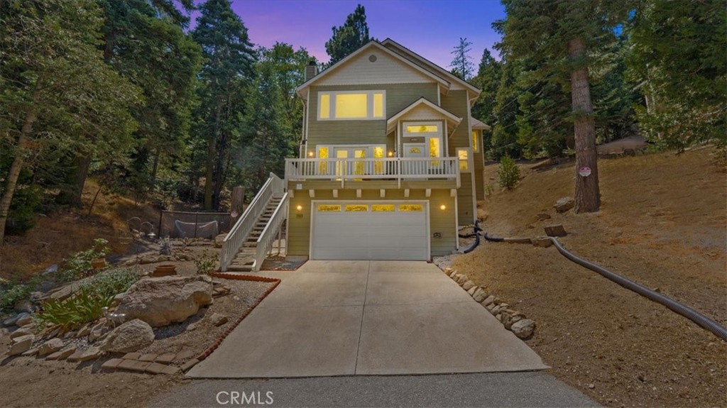 Welcome to 24583 Altdorf Drive in Crestline. This well-maintained home offers 3 bedrooms, 2.5 baths, and nearly 2,000 sq. ft. of living space. Built in 2007, it blends modern convenience with mountain living just minutes from Lake Gregory, shops, and restaurants. The main level features an open living room with vaulted ceilings, wood flooring, and a wood-burning fireplace. The kitchen is designed with granite countertops, a center island, breakfast bar, and ample cabinetry, opening to the dining and living areas. A half bath and laundry room complete the main floor. Upstairs, a spacious loft provides flexible space for an office or family room. The primary suite includes a private bath and walk-in closet, while two additional bedrooms share a full hall bath. Enjoy the outdoors with front and side decks, plus the convenience of a two-car garage and central A/C.