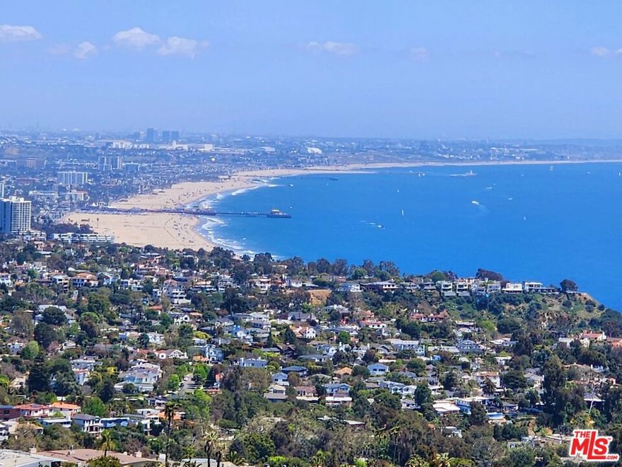 Unaffected by Recent Fires! Vista Grande Drive Remains Intact and Available Located on One of Only Three Exclusive Promontory Cul-De-Sacs In The Prestigious Marquez Knolls Neighborhood of Pacific Palisades. This custom-built residence was completely unaffected by the recent fires, as was the entire Vista Grande Drive. This exceptional home showcases panoramic views spanning Downtown Los Angeles, the Santa Monica Pier, Catalina Island, and the Santa Monica Mountains. Soaring ceilings and abundant natural light enhance the open floor plan, which features a generous great room with a fireplace and an elegant dining areaall opening to expansive outdoor terraces designed for seamless indoor/outdoor living. The outdoor spaces include a charming al fresco dining area with a fireplace, a spacious entertainment patio with a sparkling pool and spa, and a covered lounge offering spectacular views. Inside, the home offers four sunlit bedrooms, an office, five bathrooms, and a wine cellar. The gourmet kitchen is equipped with a center island, granite countertops, high-end appliances, custom cabinetry, a built-in breakfast nook, and a separate service entrance. A grand exterior staircase leads to a second pad with tremendous potential, offering access to private hillside trails and beautifully landscaped grounds with unobstructed coastal and city views. An exceptional opportunity to enjoy the amazing views and natural Palisades vistas and to continue living in our amazing town.
