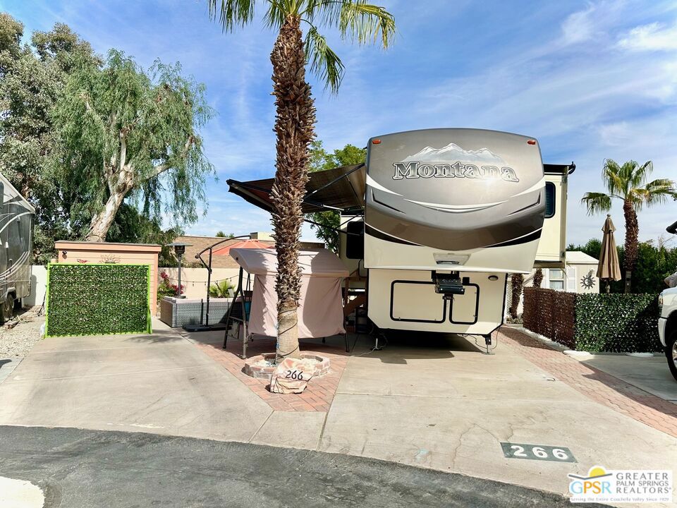 Well-Appointed 5th Wheeler for Rent in Desirable Desert Shadows 55+ Community. Enjoy resort-style living in this beautifully maintained 2015 Fifth Wheeler located in the sought-after Desert Shadows RV Resort one of the few areas where you can live year-round. The site sits on a large, landscaped, and hardscaped lot offering both privacy and space, complete with elegant pavers, a new RV pad, and a large storage shed. Just steps from the clubhouse, this rental provides easy access to the community's impressive amenities, including six pools, two large clubhouses, tennis and pickleball courts, fitness center, library, card and craft rooms, and more. Rent includes premium TV, high-speed internet, water, trash, and recycling. Desert Shadows RV Resort is a vibrant, gated 55+ community known for its friendly atmosphere, safety, and social activities. Enjoy the comfort of your own well-equipped fifth wheeler and the benefits of a full-service resort the perfect balance of relaxation and connection. Experience the best of desert living in this exceptional rental tiny home.