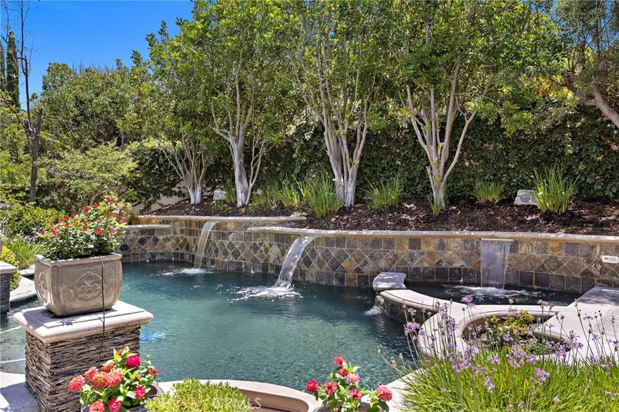 Welcome to 14 Marchin Drive, an elegant residence tucked within the prestigious guard-gated community of Coto de Caza. This beautifully maintained pool home offers 4 bedrooms, 3.5 bathrooms, a main floor office, a resort-style backyard and even an owned solar system!

The main level features a private guest suite, perfect for extended family or overnight visitors, along with spacious living and dining areas that flow seamlessly into the open-concept kitchen and family room. Upstairs, the expansive primary suite is a true retreat with its own fireplace, private balcony, and dual closets. Well-appointed secondary bedrooms provide ample space, while an additional upstairs bonus room creates a flexible area ideal for a pool table, home gym, playroom, or media lounge.

Step outside to your own private oasis—complete with a sparkling pool, relaxing spa, covered outdoor living room and a tree-lined, secluded backyard that offers ample space from neighbors for ultimate privacy. Whether enjoying quiet mornings or lively weekends, this outdoor space is perfectly designed for year-round enjoyment.

Living in Coto de Caza means access to unparalleled amenities including two private golf courses, equestrian facilities, miles of scenic trails, and a vibrant country club lifestyle. Families also benefit from award-winning schools, including Tesoro High School, making this an ideal place to call home.