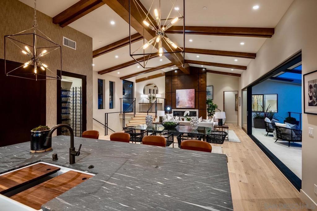 NEW CONSTRUCTION - A stunning waterfront retreat masterfully crafted by Beach City Builders, this 4,085 sq. ft. home merges innovative architecture with organic & modern design elements and is purposely oriented so you never lose sight of the main attraction – the extraordinary, sweeping lagoon and ocean views. High-end materials & custom detailing in this open concept floor plan with 5 BRs, game room with wet bar, & media room. Enjoy indoor/outdoor living with sliders to a big view deck, covered living area with BBQ, and beautiful pool & spa. Live the waterfront lifestyle and paddleboard & wakeboard in front of your own property with 77 ft. of frontage on the Agua Hedionda Lagoon. The open floor plan offers 4 bedrooms, 5.5 baths, an attached guest casita or office with separate entry, and a 3-car garage with additional parking. Floor to ceiling glass doors in the Great Room showcase the breathtaking views and create seamless indoor/outdoor living out to the large terrace. A harmonious composition of textures soothes the senses with wide plank oak floors, gorgeous counters, and beautiful cabinetry. Top-of-the-line graphite appliances, large pantry, wine chiller and a spacious island will complement all of your cooking endeavors in the gourmet kitchen. The master suite offers private views from the Juliette balcony, stunning finishes in the bath, a spa-like wet room featuring a standalone tub and shower, and his and hers custom closets. Crafted for entertainment, downstairs features a second living room that can serve as a game room with a wet bar and opens seamlessly to the covered loggia and outdoor kitchen. Spend time soaking in your private, saltwater POOL and SPA while taking in the amazing views, sunsets and wildlife. Conveniently located close to the coast, Carlsbad Village, the Del Mar racetrack, LEGOLAND, Highway 101 and I-5, this rare offering is perfectly designed to enjoy the waterfront lifestyle on the Agua Hedionda Lagoon. Equipment: Garage Door Opener,Pool/Spa/Equipment, Range/Oven Sewer: Sewer Connected Topography: LL,GSL