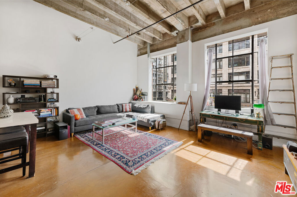Open LOFT at the SB Grand featuring glossy, polished cement floors, exposed ceiling beams, massive ceiling height, big windows and track lighting. Granite tile counter tops and stainless steel appliances complete the look. In-unit washer and dryer located conveniently in the bathroom. The location is central, situated just a few minutes from The Bloc, Grand Central market, a Farmers Market that takes place downstairs on 5th Ave every Sunday, Ralphs and Whole Foods. The building has 24-hr security front desk concierge, fitness room, rooftop pool, hot tub and rooftop lounge area with panoramic views of the Downtown Los Angeles skyline. Valet parking available onsite for $300/month. Pet friendly. Close to the Metro red line.