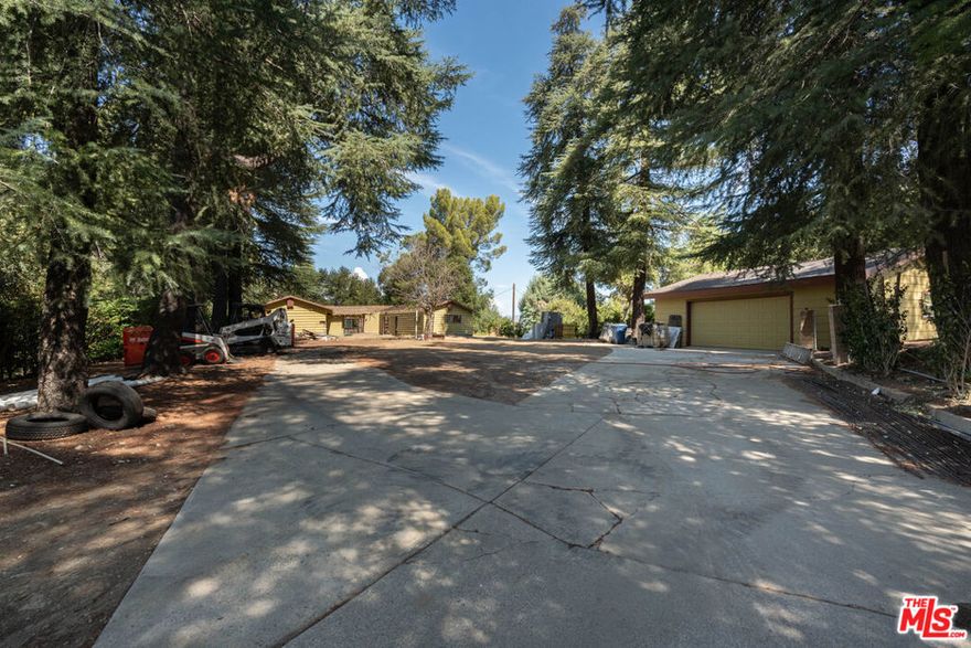 Fixer Opportunity in Sand Canyon / Newhall An incredible chance to reimagine a classic 1961 ranch-style farmhouse. Featuring 4 bedrooms, 3 bathrooms, and over 2,800 sq. ft. of living space, this property sits on an expansive 87,000+ sq. ft. lot with sweeping views above Placerita Canyon. This home is RTi-ready and primed for a full luxury remodel with no additional square footage being added, investors and owner-users alike can capitalize on the huge add-value potential. Whether you're seeking a massive return on investment or instant equity upon completion, this property offers both.Highlights include: *Oversized detached garage *Flat and usable lot with endless potential *Peaceful location in the highly sought-after Sand Canyon community *Expansive views and natural surroundings. A rare offering in a prestigious neighborhood ideal for builders, investors, or buyers looking to create their dream home.