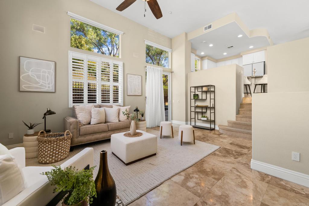 Originally a model unit, this beautiful single-family home situated in the gated community of Escala and includes travertine flooring, luxury carpeting, neutral interior paint, granite countertops, stainless steel appliances, custom built-ins, and surround sound. Featuring all bedrooms upstairs, two washer and dryer options, both upstairs and in the garage, as well as an added pantry with pull-out drawers for enhanced convenience. A spacious private yard and patio with mature trees offers a peaceful setting just steps from the Escala clubhouse and amenities. 2-car attached garage with built-in storage and tons of natural sunlight.