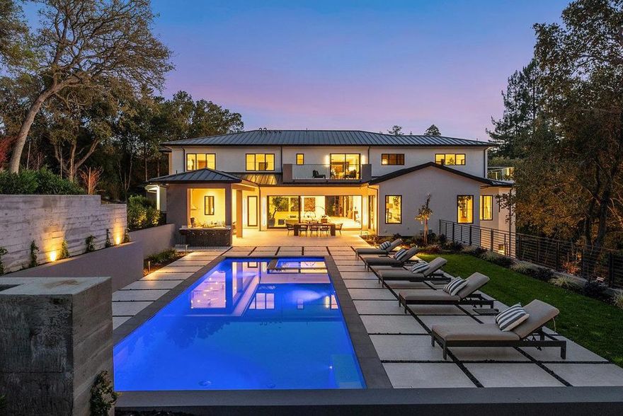 Architecturally envisioned by renowned architects Young and Borlik, this Atherton home stands apart from the rest, with its 20-foot glass front door and floating staircase spanning all 3 stories. Natural light brightens resort style spaces, designed to offer endless entertainment options for residents and guests. A layout for function, comfort and luxury; soft warm organic modern textures and hues create a haven for respite while epitomizing chicness. Every bedroom is huge, ensuite, features a walk-in closet, and feels like a primary bedroom. Lavish even by Atherton standards, the floor plan was designed to provide privacy and retreat. A departure from typical Atherton floor plans that rely on basements to round out every amenity on the bucket list air and light define this walk out lower level featuring a tiered theater, wine room, home gym, lounge and game room. Fantastically located within minutes of renowned schools, Silicon Valley Tech Giants, and famed Sand Hill Road.