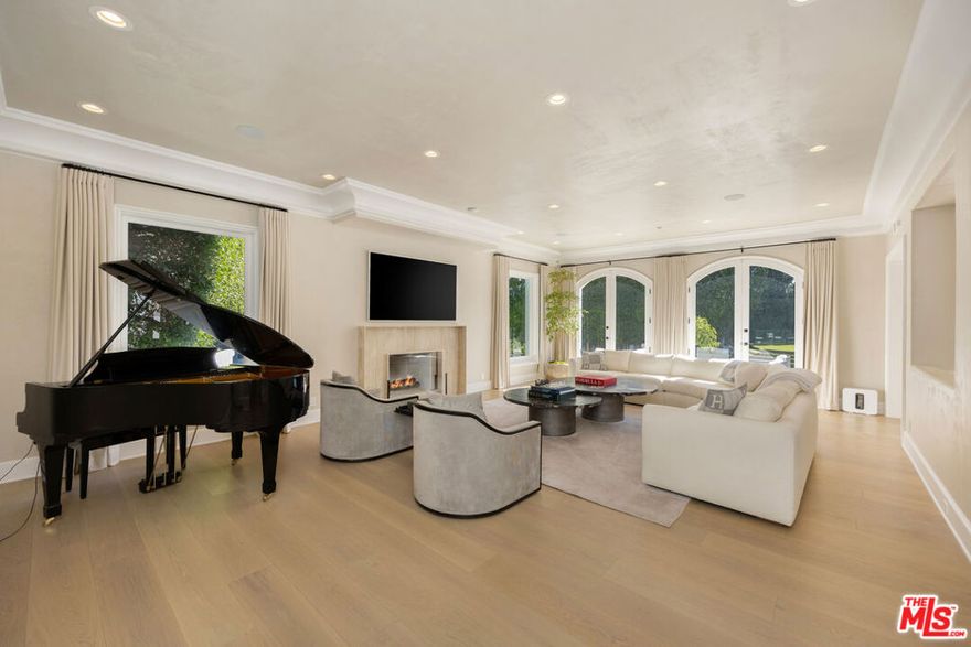 Rare tennis court estate in the Bird Streets. Half an acre of gated privacy with city, canyon, and ocean views.