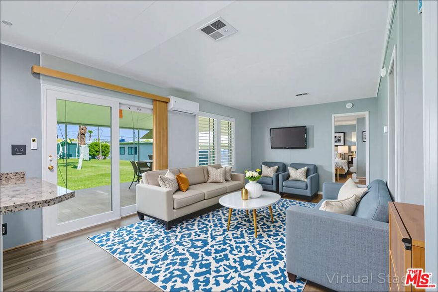 Assumable VA Loan at 4.375 % interest rate! Potential for lower down payment and closing costs! This resort-style living home is located in the desirable 55+ community of Tri Palm Estates & Country Club. Prime location situated overlooking the 15th hole on an 18 hole golf course, panoramic views, this property includes LAND OWNERSHIP with a 433A permanent foundation- no land lease necessary. One of the few homes in the community with a full 2-car garage, it also features a covered patio area with a shed for additional storage. The interior has been updated with laminate flooring, motorized blinds, newer paint inside and out, two murphy beds for space saving convenience, updated lighting, natural gas connection for your gas grill, and a newer electrical panel (2024). Home also features additional space that offers flexible use perfect for a home office, gym, or creative studio buyer to verify sq ft. For year-round comfort, the home includes four energy-efficient mini splits that allow for low-cost electric rates having IID as the electrical provider, ring security camera's in place, and dusk to dawn motion sensor's for extra security. The updated kitchen offers laminate countertops, beautiful cabinetry with plenty of storage space , and newer appliances including a Samsung side-by-side refrigerator with touch screen family hub. Out back, the covered patio includes roll-down sunshades, perfect for entertaining or relaxing while enjoying panoramic views of the golf course, palm trees, and surrounding mountains. Tri Palm Estates offers a low monthly recreation fee of $323.10 per month, which includes unlimited golf for two deeded owners on two golf courses, access to three community pools, two hot tubs, a clubhouse, tennis courts, pickleball court, shuffleboard, dog park, restaurant/bar/live music, and a library. Conveniently located just minutes from Acrisure Arena hosting pro hockey team the "Firebirds", Costco, Sam's Club, Home Depot, and the I-10, providing quick access to the entire Coachella Valley. Nearby attractions include the Palm Springs Aerial Tramway, Moorten Botanical Garden, biking CV Link, Indian Canyons/ waterfalls, and El Paseo Dr. showcasing luxury shopping! Schedule your private tour today!