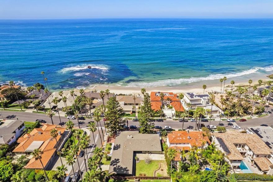 As if pulled from a time capsule of the 1950s, this incredible opportunity awaits in the highly coveted WindNSea and Lower Hermosa area. Situated on one of the most sought-after corner lots in La Jolla, this ocean-view home offers direct access to the walking path which leads to the iconic white sandy shore of WindNSea. Nestled on a sprawling 13,510 sqft lot along La Jolla’s famed "Street of Dreams," the property holds unsurpassed potential. Whether you choose to restore its vintage charm or reimagine it into a modern coastal masterpiece, this is your chance to own a rare piece of La Jolla’s liquid gold. Enjoy world-class surfing, breathtaking sunsets, and the vibrant beachside lifestyle, all just moments from top-rated schools, boutique shops, and fine dining.