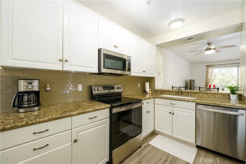 Photo of 20301 Bluffside Circle #211, Huntington Beach, CA 92646 (MLS # OC26162269)