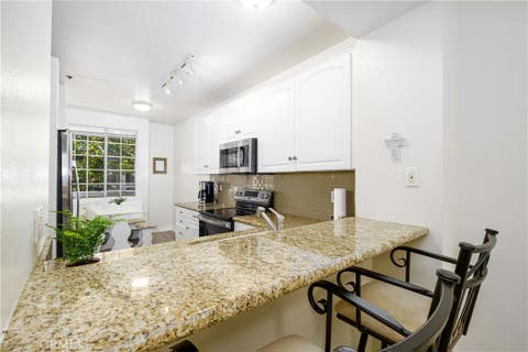 Photo of 20301 Bluffside Circle #211, Huntington Beach, CA 92646 (MLS # OC26162269)