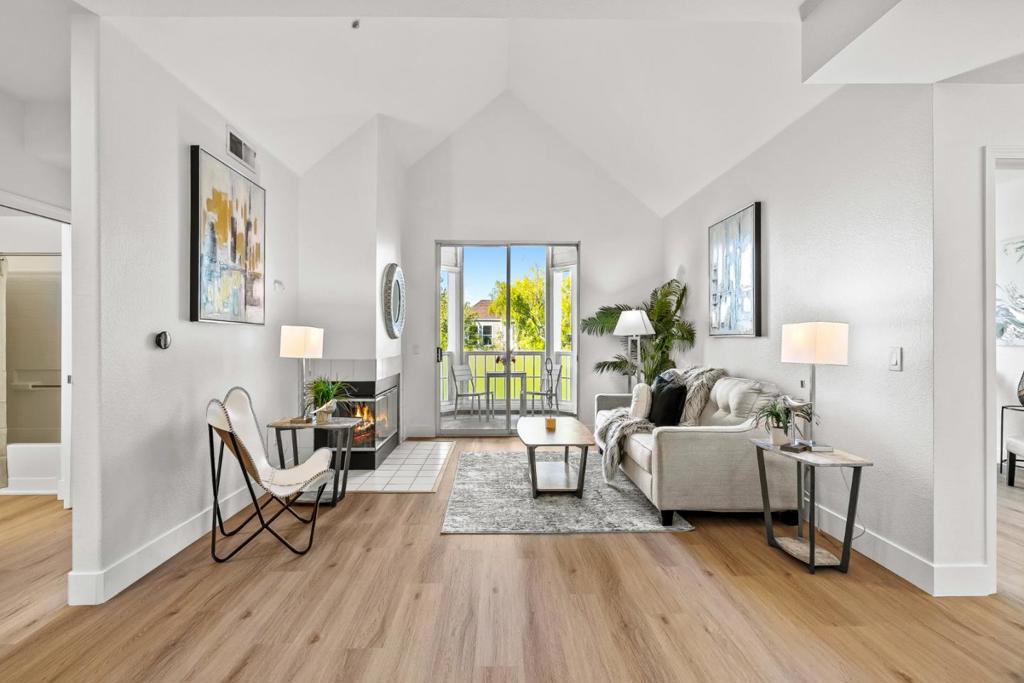 Stunning 2-bed, 2-bath penthouse in the coveted Ryland Mews community, set in Downtown San Jose's historic Hensley District. A rare offering with very low turnover, this is the only residence on its floor, delivering true privacy with no neighboring units. Fresh paint, beautiful new flooring throughout, and dramatic vaulted ceilings brighten the open living space. Flexible layout includes a separate office/den (potential 3rd bedroom, buyer to verify). The updated kitchen features stainless appliances and abundant cabinetry/shelving; relax by the wood burning fireplace or step out to two private balconies with lush green courtyard views for fresh air living. Included are 2 assigned garage parking spaces + a resident guest-parking permit with EV parking stations and a dedicated storage locker in the garage. Resort-style amenities: pool, fitness center, landscaped courtyards, and BBQ areas. Prime urban location near San Pedro Square, SAP Center, dining, nightlife, and great neighborhood parks, with easy access to Hwy 280/101/87. Turnkey, private, and perfectly situated. Heres your chance to secure a rarely available Ryland Mews penthouse with unmatched privacy. Website: www.rylandmewsunit418.com