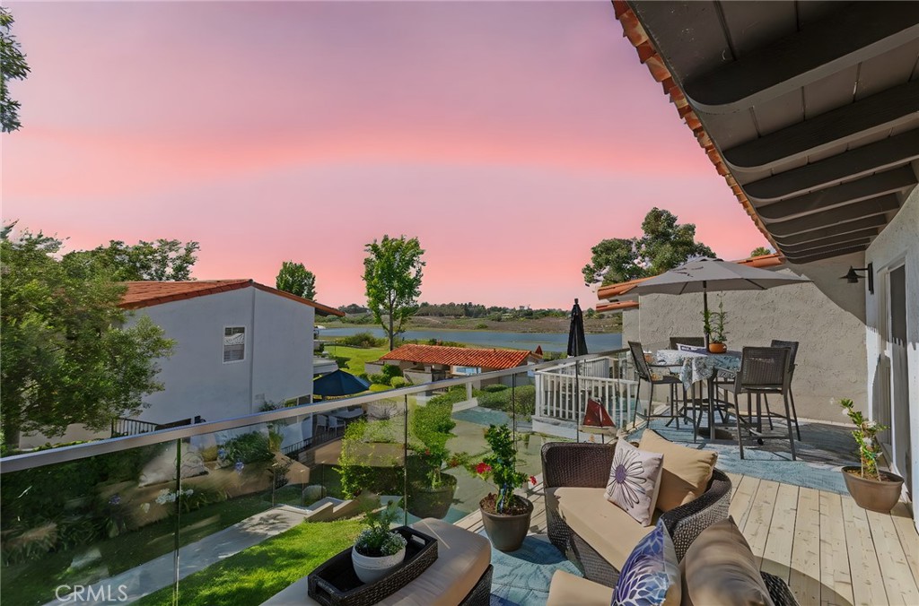 Imagine waking up to breathtaking bay views every morning in a home where every detail exudes elegance and modern luxury. This is the ultimate turnkey home—everything is taken care of for you! Welcome to this exquisite, recently remodeled Delores plan, an elegant end unit that offers the best in coastal living. Step onto a spacious glass-railed deck and into a gated entry courtyard that sets the tone for what’s inside. The upstairs rooms provide a stunning bay view, perfect for starting and ending your day in serenity. This home features stylish shutters on the windows, luxury vinyl floors throughout, and a modern kitchen designed to impress. Cooking becomes a joy with high-end quartz countertops, brand-new Café stainless appliances, custom white cabinets, and a striking six-burner gas cooktop. The open layout seamlessly connects the kitchen, dining room, and family room, making it ideal for relaxing and entertaining. No detail has been overlooked—replaced doors, new hardware, and elegantly remodeled bathrooms add to the sophisticated ambiance.
Additionally, ice-cold air conditioning ensures your comfort throughout the year. One of the best benefits is the low HOA of $375; that's amazing! This gorgeous home is situated in a prime location and offers ample guest parking, as well as easy access to the community pool. The Newport Beach Tennis Club and a nearby shopping center are just a short walk away, and the 73 Toll Road is only minutes from your doorstep. Fashion Island is nearby; what more could you ask for? This is a rare opportunity to own a beautifully remodeled home in one of Newport Beach’s most desirable areas. Don’t miss out!
