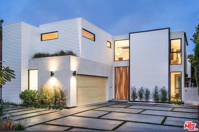 From renowned designer-builder Mario Romano comes this Santa Monica architectural stroke of genius that fuses form & function to achieve a new expression of modern California living. The 6-bedroom home defies convention at every turn, beginning with an 11-ft, skateboard deck-inspired pivot front door & 25-ft 3D-printed M.R. Wall employing rainscreen-science to naturally improve energy efficiency. Inside, a unique open floor plan creates visual & spatial connections throughout the home's 3 levels, & a massive skylight positioned at the core cascades natural light into every space, including the home's large great room & dining room. The state-of-the-art kitchen features custom-crafted FENIX cabinetry & a 16-foot Corian island counter with embedded wireless charging. A sprawling lower level includes dual entertainment rooms, one of which presents a first-of-its-kind 3D printed backlit wall. Expansive pocket sliding doors flow to the large backyard, replete with lounge areas & fire pit.