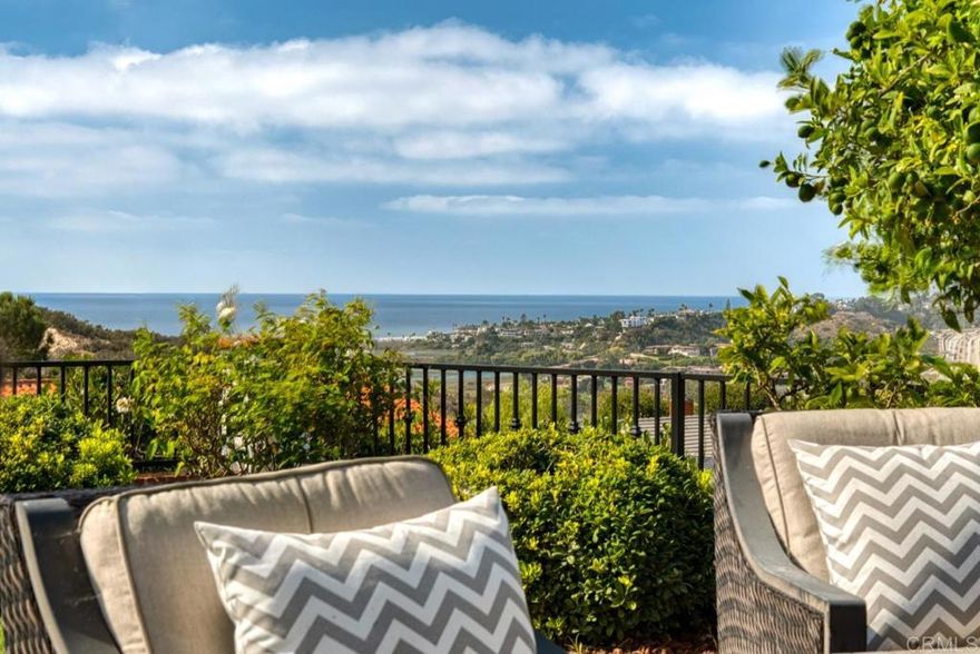 DRAMATIC PRICE REDUCTION! Bring your buyers now! This home offers stunning panoramic white water ocean and San Elijo Lagoon views. Situated on a rare 1/3 acre corner beautifully landscaped lot, this warm and stunning family home includes a large flat backyard for family fun and adult entertainment with built-in barbecue grill, several outdoor seating areas, a spa with ocean views and water features. Inside this remodeled home features 5 bedrooms and 3 full baths, with a first floor containing an expanded family room, enlarged dining room, formal living room with fireplace, an indoor laundry room with washer & dryer, and a convenient downstairs bedroom with remodeled full bath. Upstairs the enormous primary suite captures breathtaking ocean and lagoon vistas with spa inspired jacuzzi bath & shower, walk-in closet and an expansive retreat area for ocean sunset viewing. Three additional bedrooms and remodeled bathroom complete the upper level. Additional highlights include a newer washer & dryer, 3 car attached garage with EV charger, huge extra storage in added garage attic, owned solar system and impeccably maintained freshly painted exterior. Professionally staged to showcase its timeless elegance and is move-in ready, this warm and inviting home is located near award winning schools, boutique shops and top restaurants. Beaches are just minutes away, creating the ultimate blend of luxury, convenience and coastal living. This is truly a rare find!