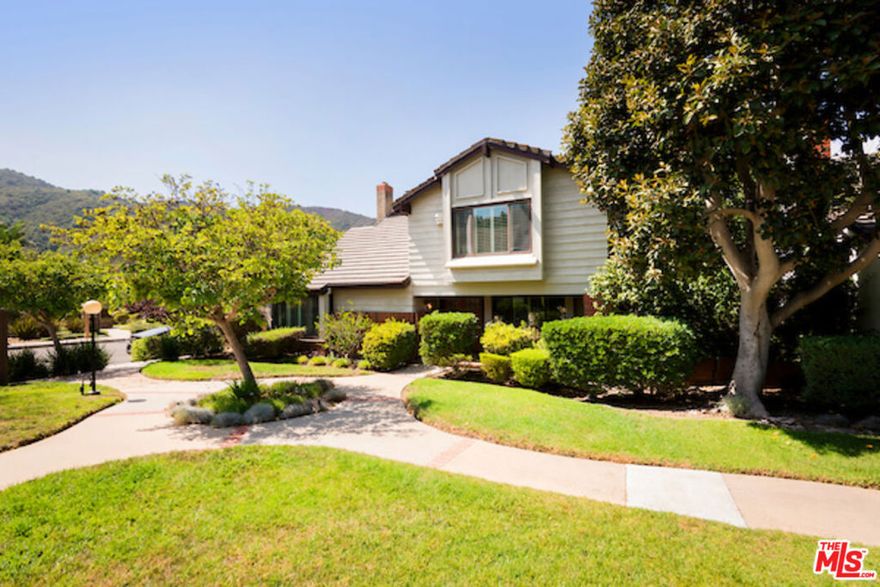 Come join the renewed sense of community in the Palisades Highlands. People are coming back and life seems almost normal here. This is a very warm home with many upgrades and generous use of wood and natural stone surfaces. The lower level has beautiful wide-plank oak floors throughout. The living room has a tongue and groove, beamed and vaulted ceiling. The kitchen is upgraded with a live-edge granite counter top, quality stainless steel appliances, induction cooktop and lots of counter and cabinet storage space. Four bedrooms and two bathrooms are all upstairs. The Primary bedroom has vaulted, tongue and groove ceiling, a unique pot belly stove gas space heater to cozy up to on those chilly winter nights. The Primary bath has a combo steam unit/bathtub/shower room that is very spa-like. The back yard has recently been completely redone with a privacy hedge and new large, low-maintenance synthetic lawn. Situated on a very quiet street, the views of the Santa Ynez Mountain Ridge brings in a peaceful nature vibe and sense of tranquility that sweeps you away from today's hustle bustle, hectic world. A fantastic amenity, the Santa Ynez Recreation Center, complete with 25 yard lap pool, kiddy pool, spa, children's playground, tennis and pickle ball courts, gym, ping-pong and billiards, is right around the corner. It is also very close to the endless network of hiking and biking trails of the Santa Monica Mountain Range, with several trailheads within a couple of minutes. Nearby local restaurants are also close and the new Caruso Center in the Palisades village is just a few minutes away. A great home in a great location that offers a great lifestyle.