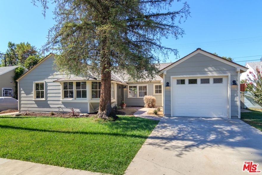 Beautifully remodeled 4+2 on a quiet street! Features include a designer kitchen w/custom shaker cabinets, quartz counter-tops, Jenn Air range, stainless sink and vent hood & LG dishwasher. The oversized master suite features a bay window & sitting area, new plush carpet & en-suite bath w/seamless glass shower & tile finishes. The spacious living room has hardwood floors, fireplace, built-in book shelves/library and opens to a patio area with plenty of room for entertaining. Full size bath w/soaking tub, glass counter-tops, custom vanity & wood look tile floor. One of the bedrooms features French doors that open to side yard. The back yard features drought resistant landscaping for easy maintenance and a large storage shed. The back/side yards are fenced. Laundry closet w/full size washer & dryer. Charming front courtyard. Freshly painted inside/out. New attached garage, new Hardiplank siding. Seller to credit buyer $1,000 toward a new refrigerator at close of escrow! Incredible value!