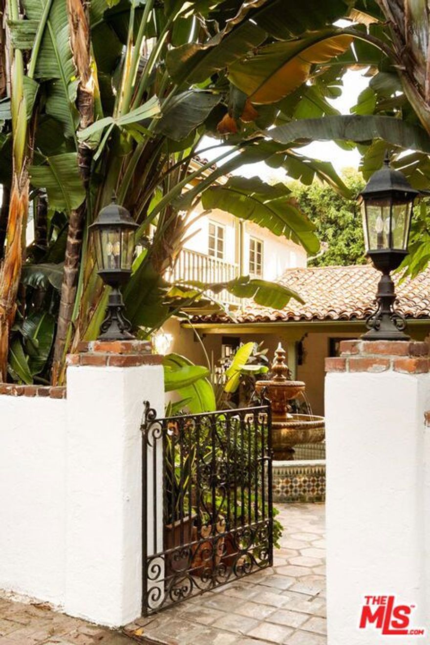 Welcome to this stunning Spanish-style estate at 1800 Outpost Drive., a beautifully gated, hedged, and private residence that seamlessly blends classic elegance with modern luxury. Boasting 4 bedrooms and 3.5 bathrooms, this home offers an ideal layout for both entertaining and comfortable everyday living. The home's high ceilings and rich wood floors create an inviting atmosphere throughout, complemented by abundant natural light streaming in through French doors that lead to the pool, spa, and covered patios.The downstairs features an oversized living room with beamed ceilings, perfect for hosting guests or relaxing with family. Adjacent is a spacious dining room and a gourmet kitchen equipped with top-of-the-line Sub-Zero, Viking, Wolf, and Miele appliances. A family room provides the perfect space for relaxing, watching TV, or casual gatherings. A convenient powder bath serves guests, while a bedroom with an en-suite full bath provides privacy and comfort for visitors or live-in accommodations.Upstairs, the primary suite is a true retreat, complete with an en-suite bathroom, walk-in closet, and private balcony overlooking the pool. The second and third bedrooms each offer their own charm  the third bedroom with a private balcony, and the fourth bedroom sharing a well-appointed bathroom. A hallway balcony overlooking the courtyard adds a touch of elegance and a serene view from above.Step outside to a private backyard and a Saltillo-tiled courtyard with a fountain and built-in BBQ area, offering a peaceful oasis for relaxation or entertaining. The pool with spa, covered patios, and expansive gated driveway with a garage add to the luxurious lifestyle this home provides. This residence is partially furnished, allowing for an effortless move-in experience while showcasing its sophisticated style.Situated in a highly desirable area, this home provides the perfect combination of privacy and convenience. Residents enjoy proximity to top-rated schools, shopping, dining, and recreational options, making 1800 Outpost Drive. not just a home, but a prime location in one of the most sought-after neighborhoods. Available for a minimum 13-month lease term.