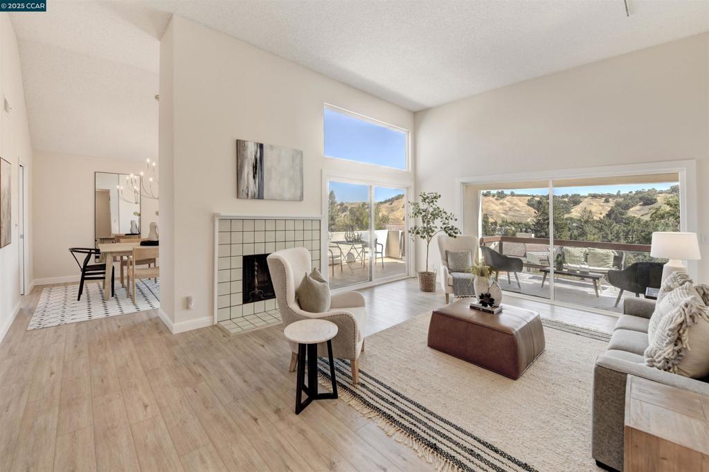 Desirable Villa Verde Condo in Rossmoor! Beautifully updated and move-in ready, this 2-bedroom, 2-bath home offers style, comfort, and convenience. Highlights include luxury vinyl flooring in the living areas, fresh interior paint, and a refreshed kitchen with new countertops, stovetop, hood, and flooring. The bright, open living space features soaring dual-pane windows, vaulted ceilings, track lighting, and a cozy fireplace. A separate breakfast nook, adjacent laundry area, and formal living room provide both function and flexibility. Enjoy the versatility of a finished loft, the convenience of an attached garage plus an additional carport, and the luxury of a spacious wraparound balcony with sweeping hillside views. Ideally situated near scenic hiking trails and tennis courts, this condo perfectly blends modern updates with a prime location. Don’t miss the opportunity to make this exceptional Villa Verde residence your new home!