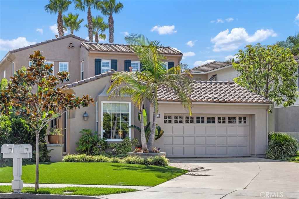 Tucked into the sought-after gated enclave of St. Augustine I, this exceptional Huntington Beach home captures the essence of coastal California living. Ocean breezes drift through the neighborhood daily while you enjoy the privacy and security of this exclusive community. From the moment you arrive, the inviting courtyard entrance hints at what's inside. Step through the front door and the home opens up dramatically—soaring beamed ceilings, gleaming stone tile floors, and an eye-catching wrought-iron staircase create an impressive first impression. The dual-sided stone fireplace anchors the spacious living room, perfect for both everyday living and special occasions. The main floor hosts a luxurious primary suite with a spa-like bathroom. The remodeled bathroom features his-and-hers vanities, a jetted soaking tub, an expansive walk-in shower finished in travertine, and a generous walk-in closet. Down the hall, a bright office with direct patio access makes working from home a pleasure—or convert it back into a third bedroom if you need the space. Head upstairs to discover a second bedroom plus a flexible bonus room that could serve as bedroom number four, and a full bath appointed with granite counters, tile flooring, and another oversized walk-in shower. The kitchen is a chef's delight, completely reimagined with granite surfaces, quality custom cabinetry, and stainless appliances. It flows naturally into the dining area and glass-enclosed sunroom—a favorite spot flooded with natural light where morning coffee tastes better and dinner parties linger late. Practical touches include a dedicated laundry room connecting to the two-car garage, which comes equipped with durable epoxy flooring and built-in storage solutions. Outside, the backyard delivers on California's indoor-outdoor promise. Professionally designed hardscaping and smart, low-maintenance landscaping create the perfect setting for sunset gatherings or quiet Saturday mornings. Those refreshing ocean breezes a daily reminder of why Huntington Beach living is so special. With award-winning schools, world-class dining, excellent shopping, and the iconic Huntington Beach coastline all within minutes, 6266 Jasmine Drive isn't just a house—it's the lifestyle you've been looking for!