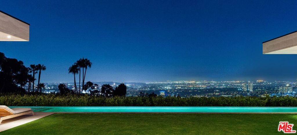 Ascend a long private driveway to a grand motor court leading to this warm sophisticated modern home nestled on an acre of land surrounded by lush landscape overlooking LA city. Unmatched design and quality. Located in the best location of the Sunset Strip.